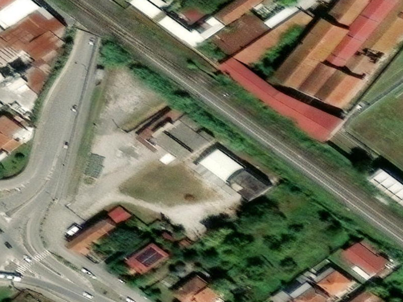 The Silent Symphony of Sarzana's Forgotten Factory]
[